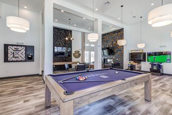 Entertainment room with billiards and gaming stations